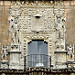 La facciata della Casa de Montejo che rappresenta conquistatori spagnoli che calpestano le teste dei vinti indigeni