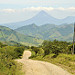 Strada per Rio Chiquito ed in lontananza la vista del vulcano Arenal
